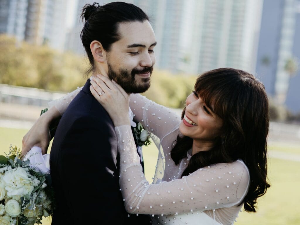 bride and groom laughing and sharing candid moment on their wedding day