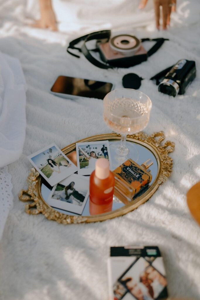 Flat lay of wedding content creator tools including camera, vow book, and bridal accessories